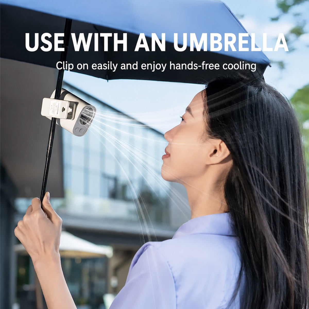 Clip-on portable fan attached to an umbrella for hands-free cooling
