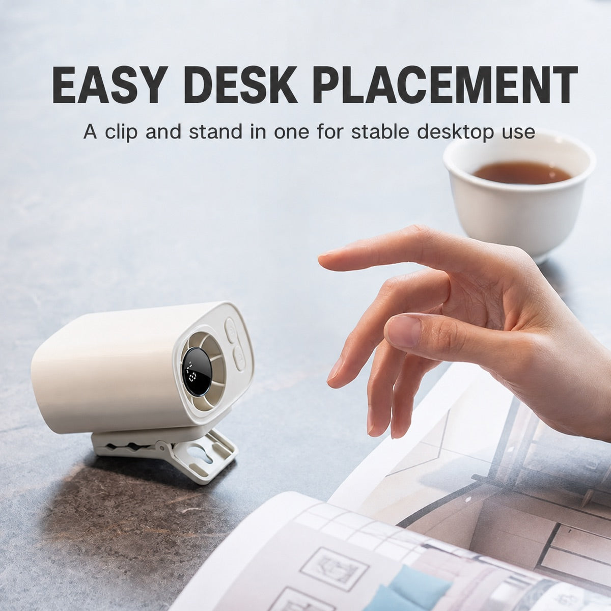 Clip-on portable fan standing on a desk